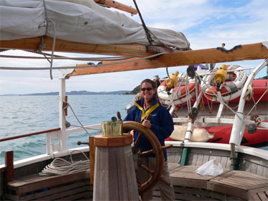 Sally at the wheel of a tall ship