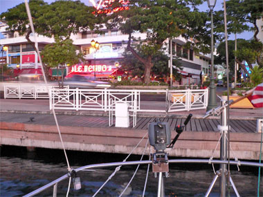 Quay in Papeete with cars zooming by
