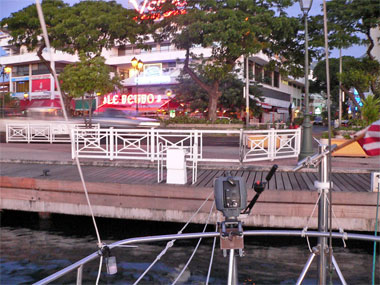 Quay in Papeete with cars zooming by