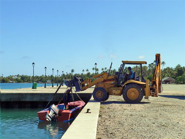 launching a boat in the Tuamotus